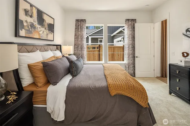 a bed room with a bed and a tv on the dresser