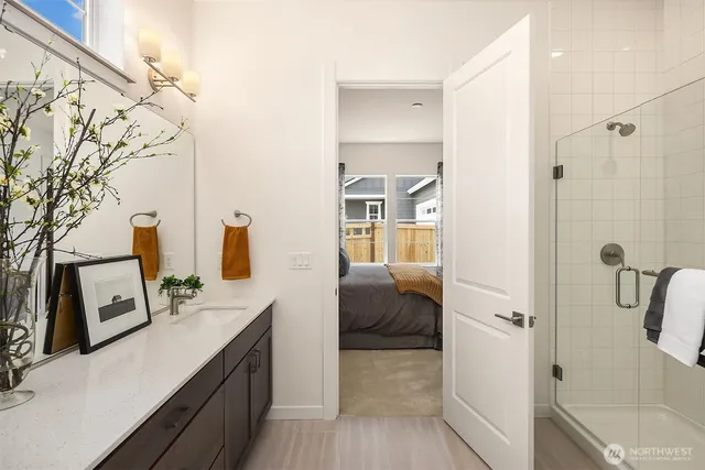 a en suite bathroom with a sink and mirror