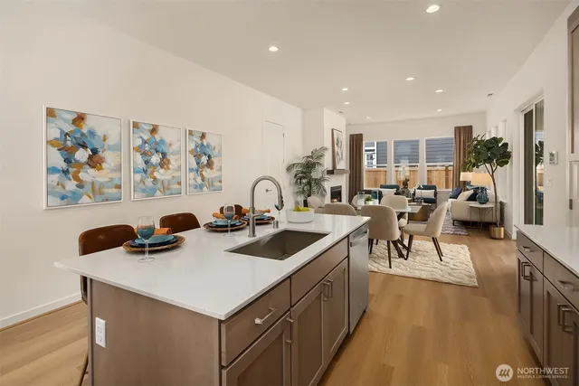 a kitchen with a sink a stove and a refrigerator