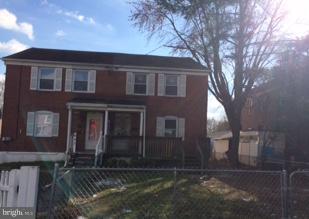 625 Delaware Avenue Baltimore, MD 21221 - Photo 1 of 6 a brick house with tree in front of it