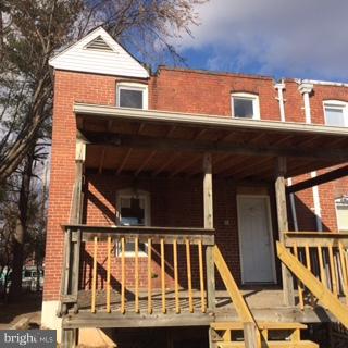 625 Delaware Avenue Baltimore, MD 21221 - Photo 5 of 6 a view of small house with wooden stairs