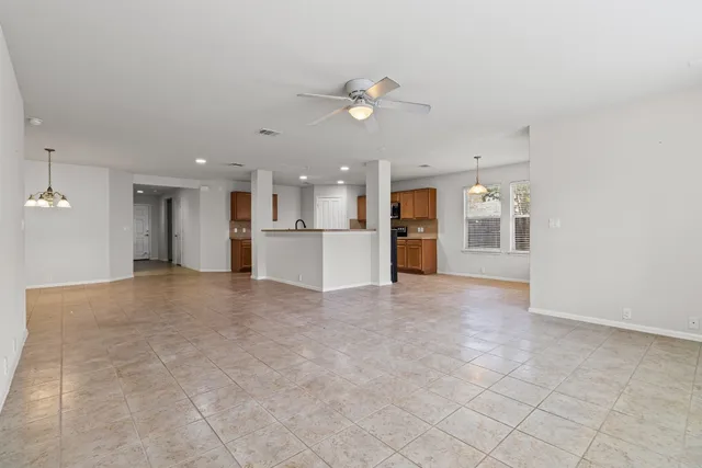 a view of a kitchen with a sink and a kitchen counter top
