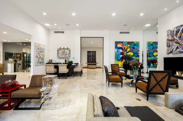 a view of a kitchen with stainless steel appliances granite countertop a sink dishwasher stove and oven with wooden cabinets