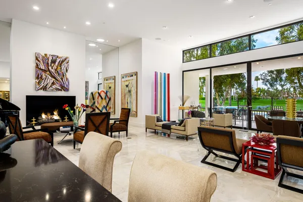 a view of a livingroom with workspace and a flat screen tv