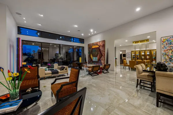 a living room with fireplace furniture and a flat screen tv