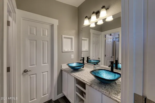 a bathroom with a glass shower door