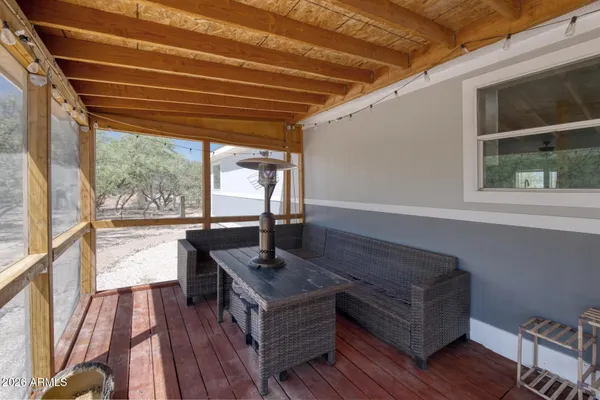 a view of a balcony with wooden floor