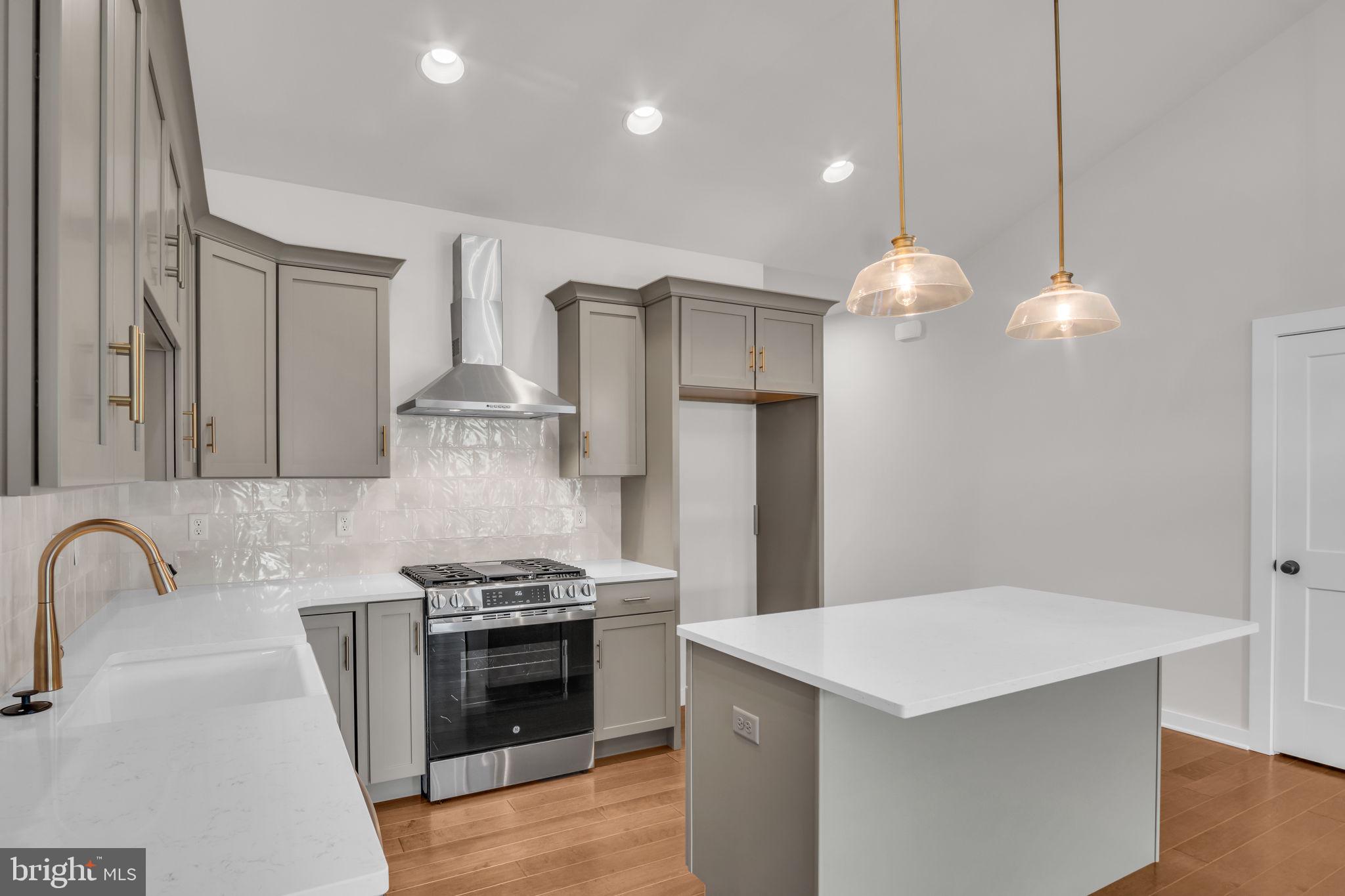 880 Shadowbrooke Dover, PA 17315 - Photo 3 of 12 a kitchen with stainless steel appliances a stove a sink and a refrigerator