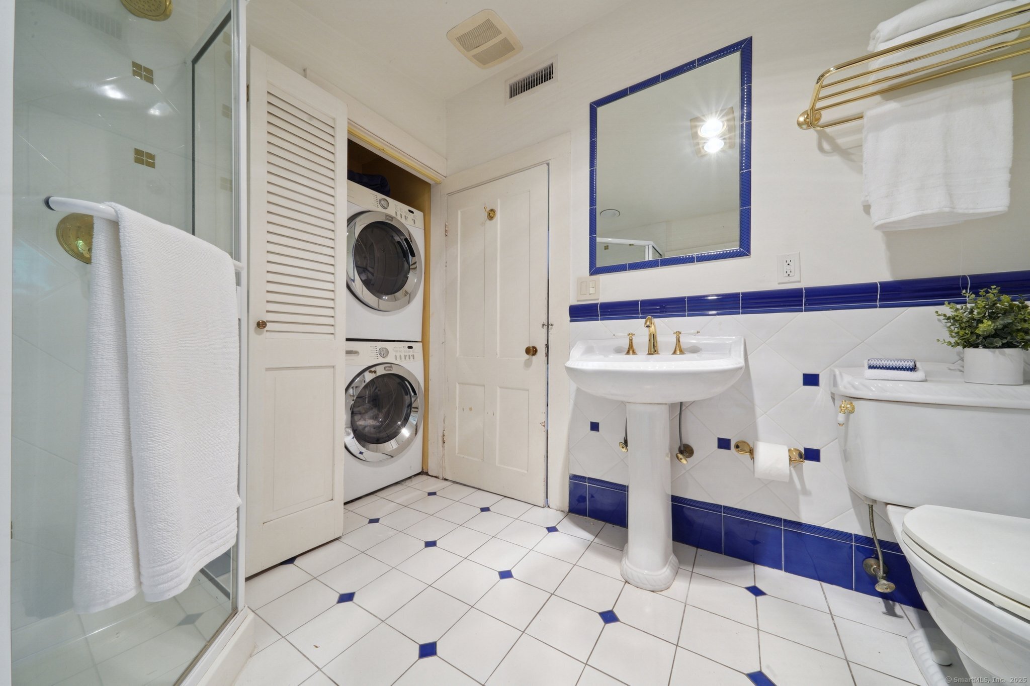 342 Greens Farms Road Westport, CT 06880 - Photo 14 of 31 a bathroom with a sink a mirror and shower