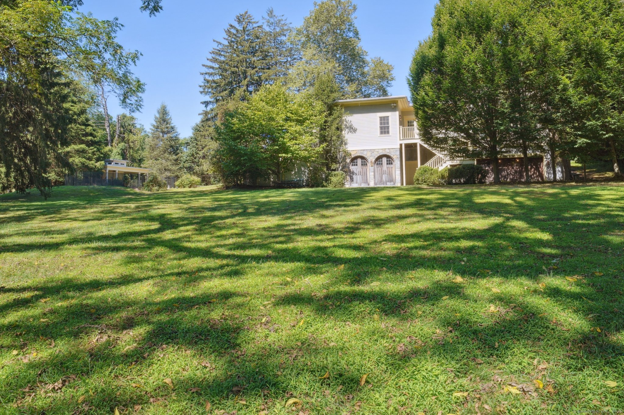 342 Greens Farms Road Westport, CT 06880 - Photo 2 of 31 a view of a trees in a yard with a house