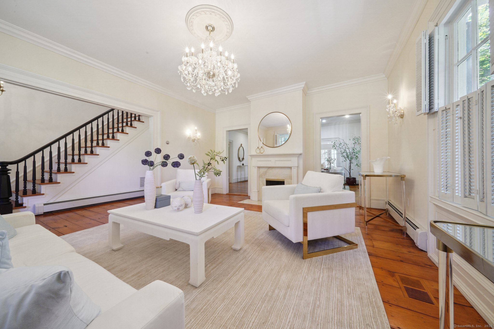 342 Greens Farms Road Westport, CT 06880 - Photo 4 of 31 a living room with fireplace furniture and a chandelier