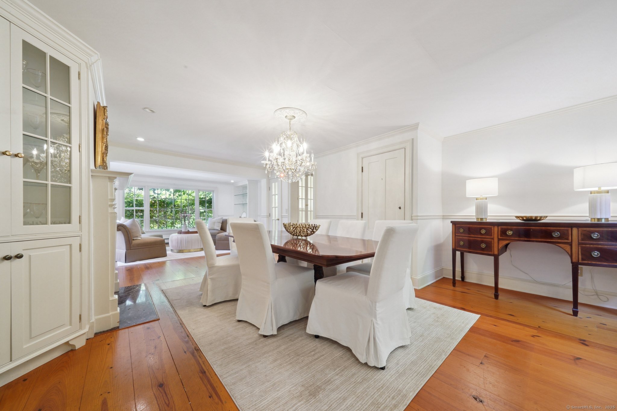 342 Greens Farms Road Westport, CT 06880 - Photo 7 of 31 a living room with furniture a large window and a dining table