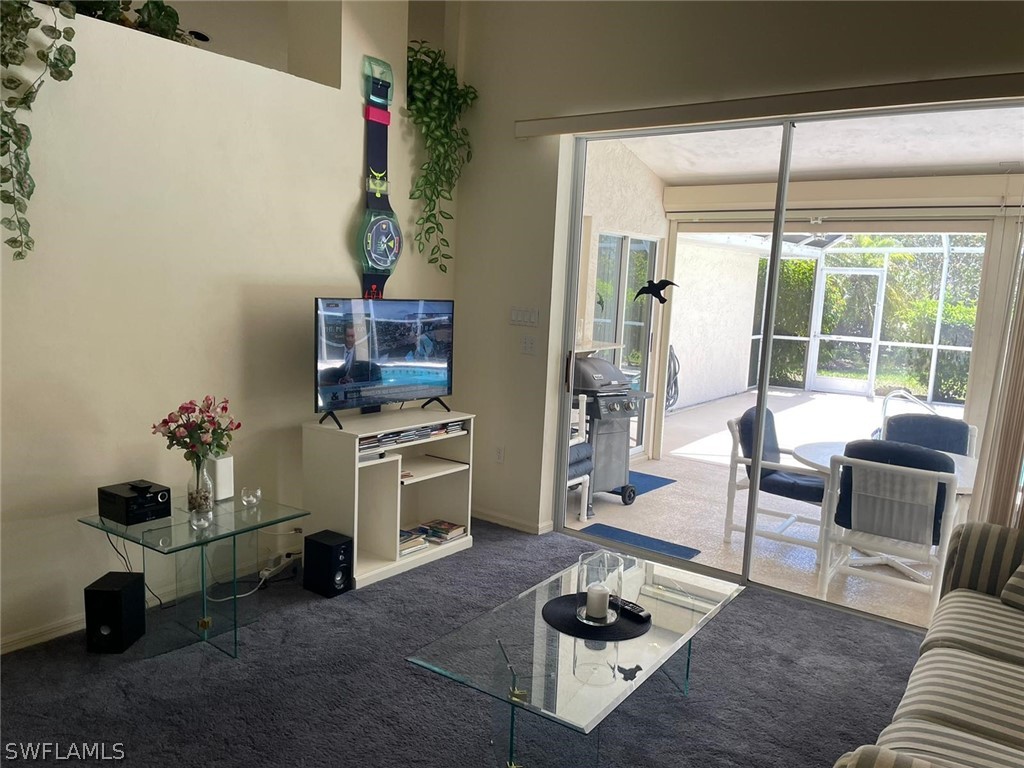 690 Morning Mist Lane Lehigh Acres, FL 33974 - Photo 6 of 20 a living room with furniture and a window