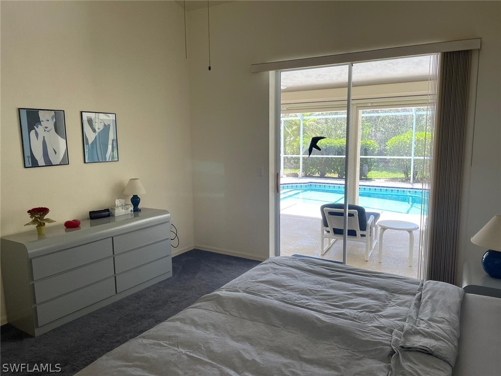 690 Morning Mist Lane Lehigh Acres, FL 33974 - Photo 9 of 20 a room with a bed and a table