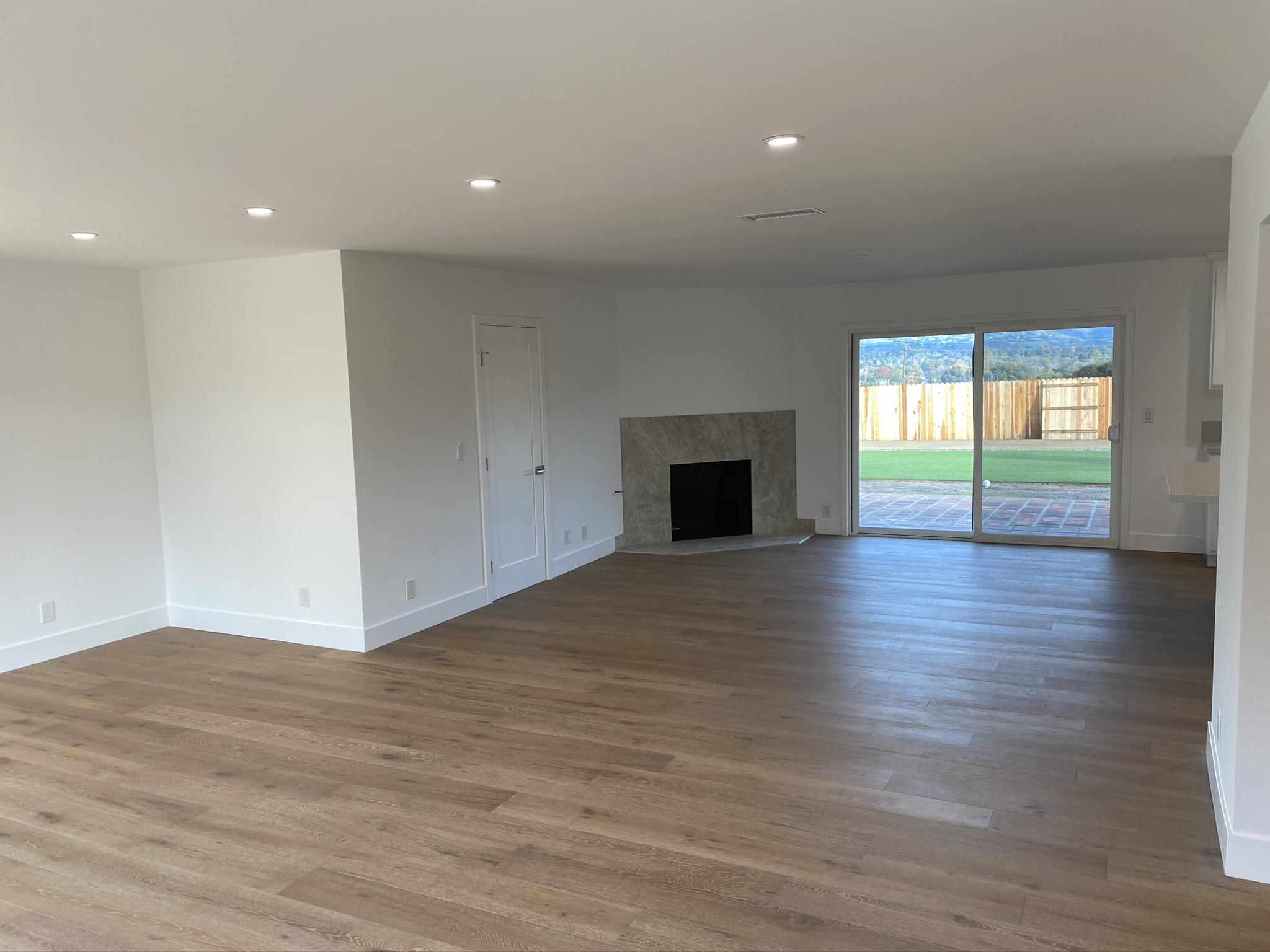 5160 Via Valverde Santa Barbara, CA 93111 - Photo 4 of 12 a view of empty room with wooden floor and fireplace