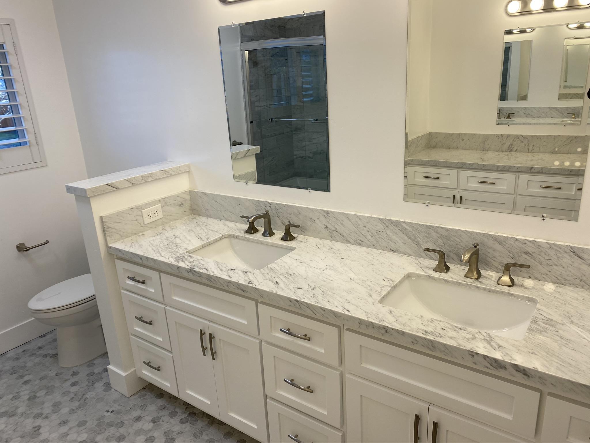 5160 Via Valverde Santa Barbara, CA 93111 - Photo 9 of 12 a bathroom with a granite countertop double vanity sink and mirror