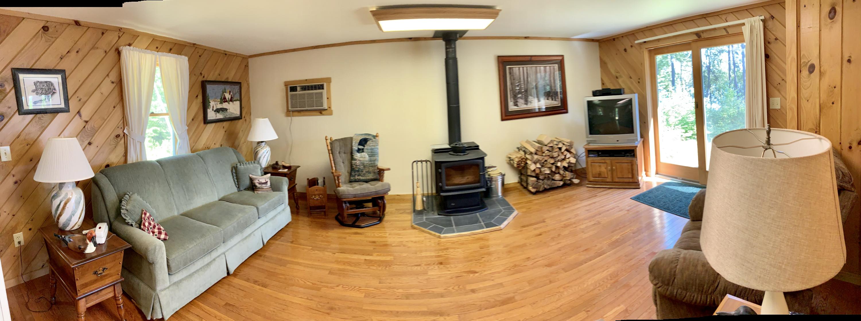 277 Shore Rd Lake View North Milo, ME 04463 - Photo 18 of 59 Living Rm w/Patio Doors Overlooking Lake