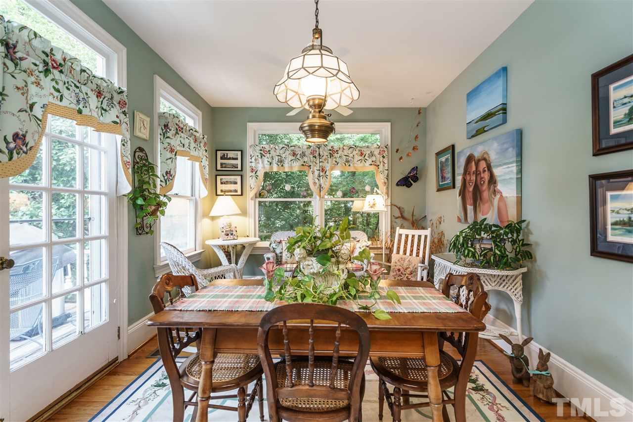 325 Polk Street Raleigh, NC 27604 - Photo 5 of 25 a view of a dining room with furniture window and wooden floor