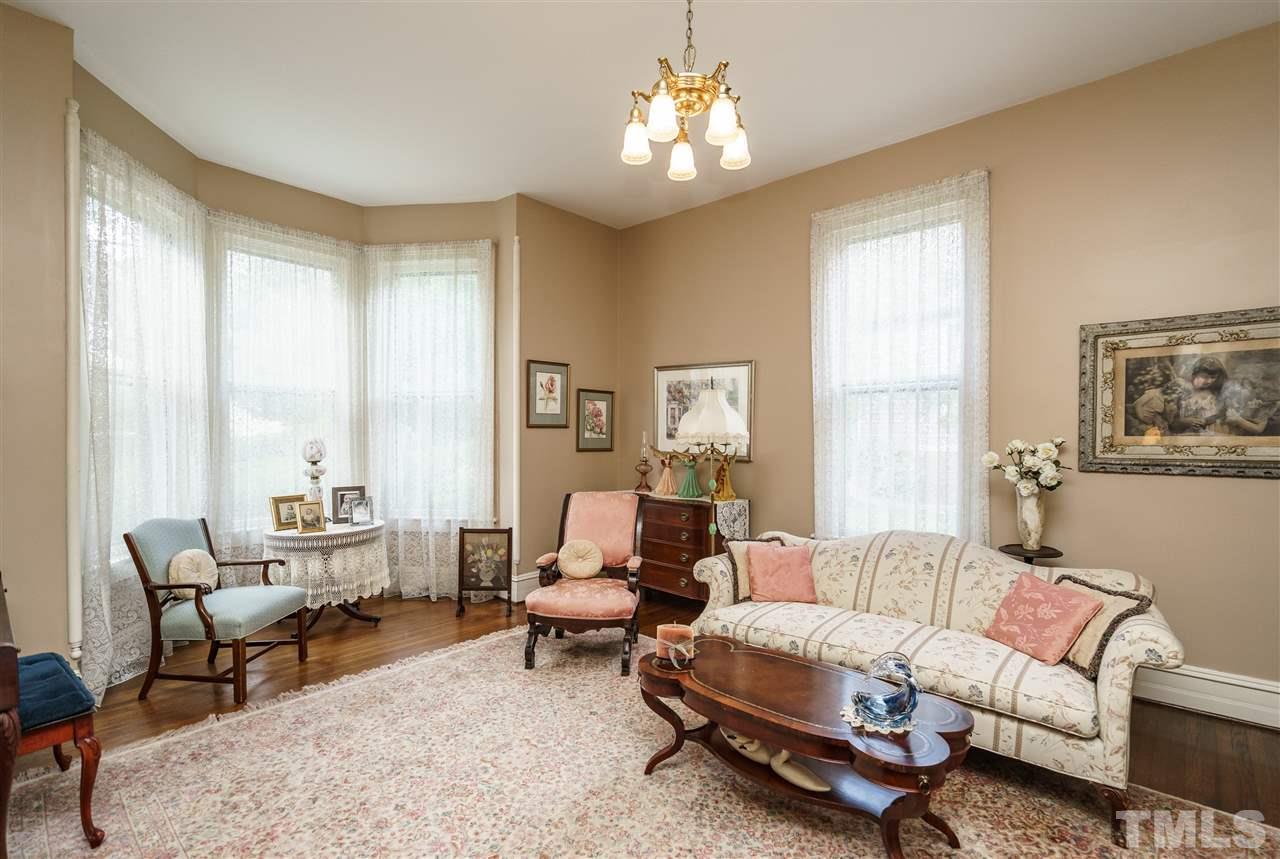 325 Polk Street Raleigh, NC 27604 - Photo 9 of 25 a living room with furniture and a large window