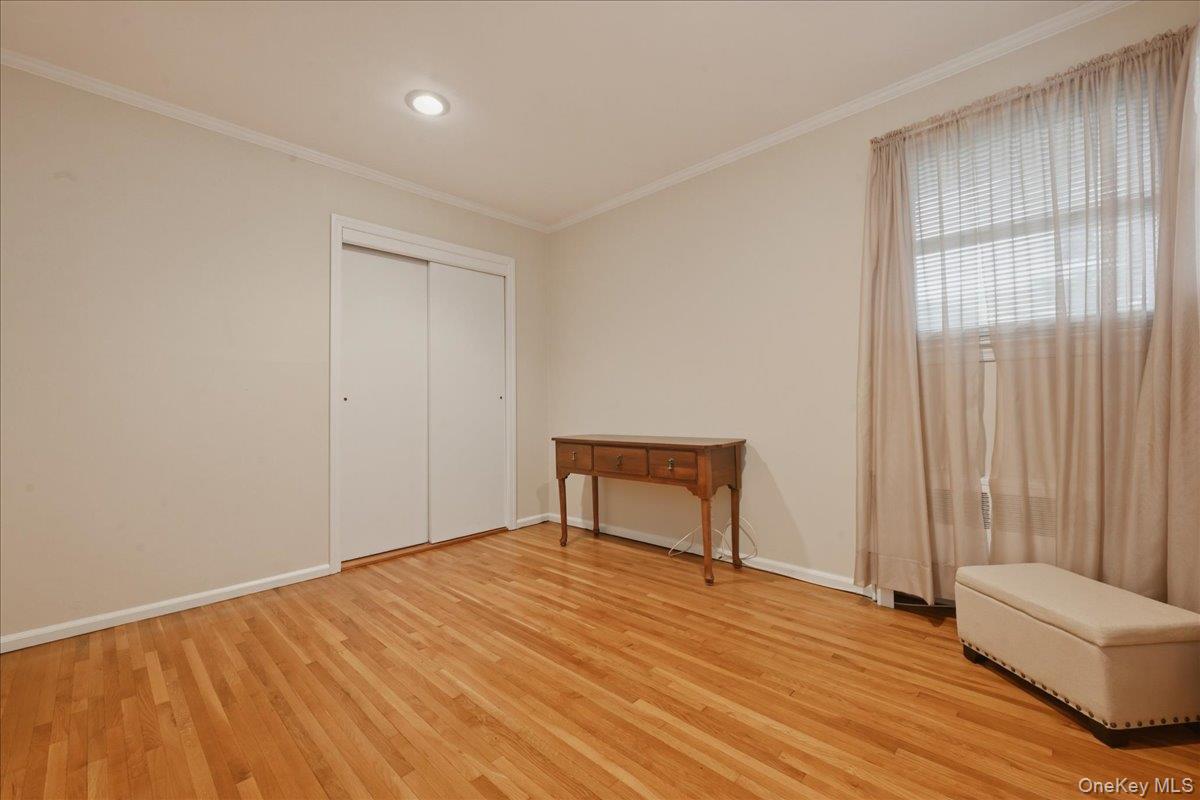 17 Avon Road Farmingdale, NY 11735 - Photo 23 of 46 a room that has a bed and a chair