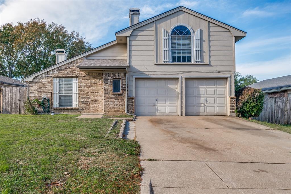 803 Canary Lane Mansfield, TX 76063 - Photo 1 of 25 a front view of a house with a yard and garage