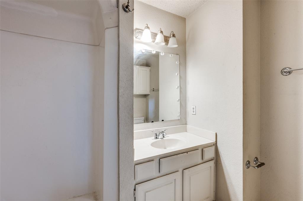 803 Canary Lane Mansfield, TX 76063 - Photo 24 of 25 a bathroom with a sink and a mirror