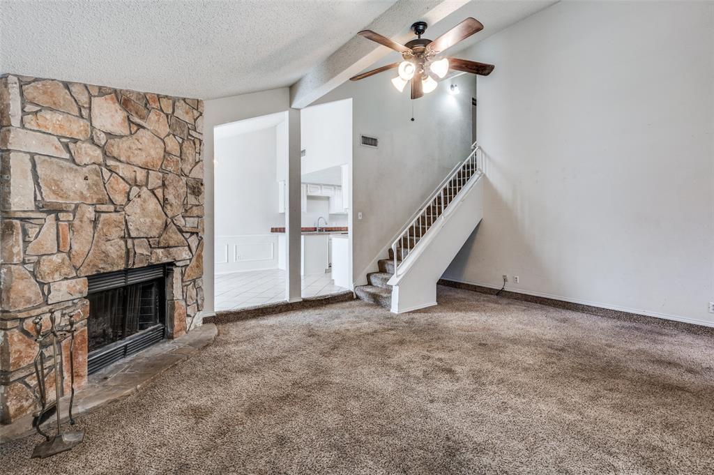 803 Canary Lane Mansfield, TX 76063 - Photo 6 of 25 a view of an empty room with a fireplace