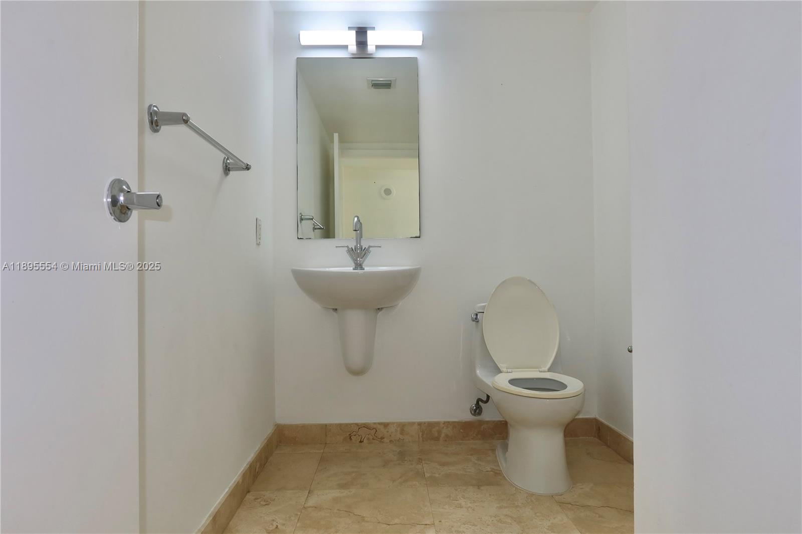 41 Southeast 5th Street, Unit 1611 Miami, FL 33131 - Photo 4 of 12 a bathroom with a toilet sink and shower