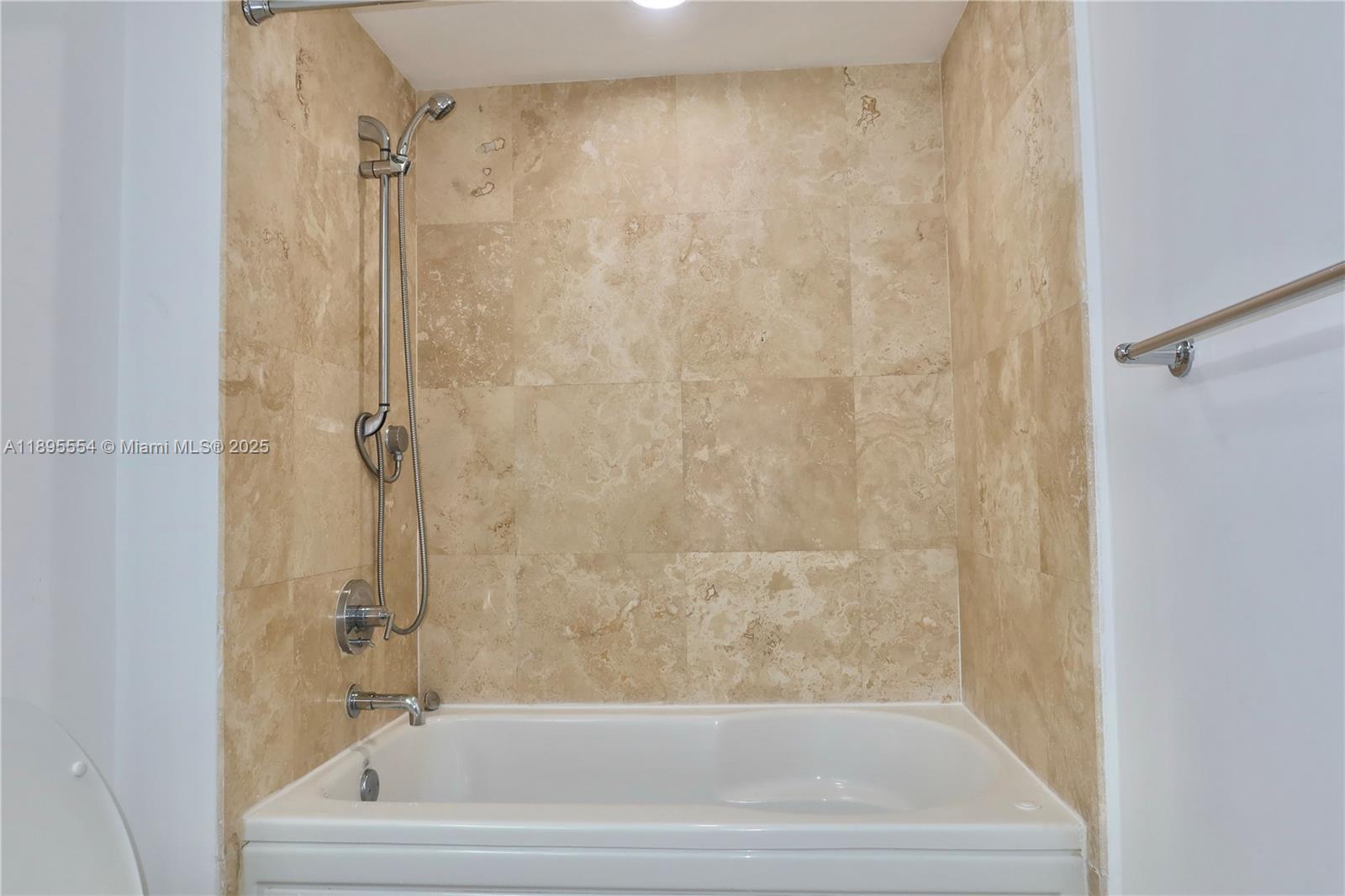 41 Southeast 5th Street, Unit 1611 Miami, FL 33131 - Photo 10 of 12 a bathroom with a bathtub