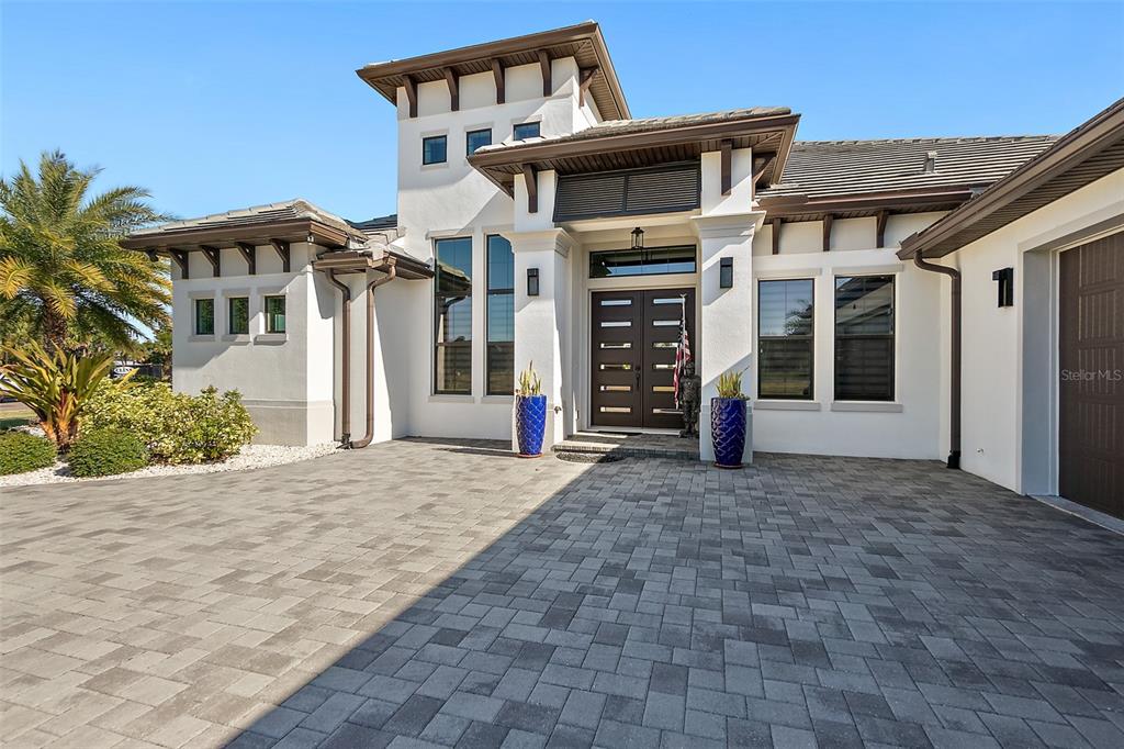 100 Seaside Pt Point Flagler Beach, FL 32136 - Photo 13 of 70 a front view of a house with a yard