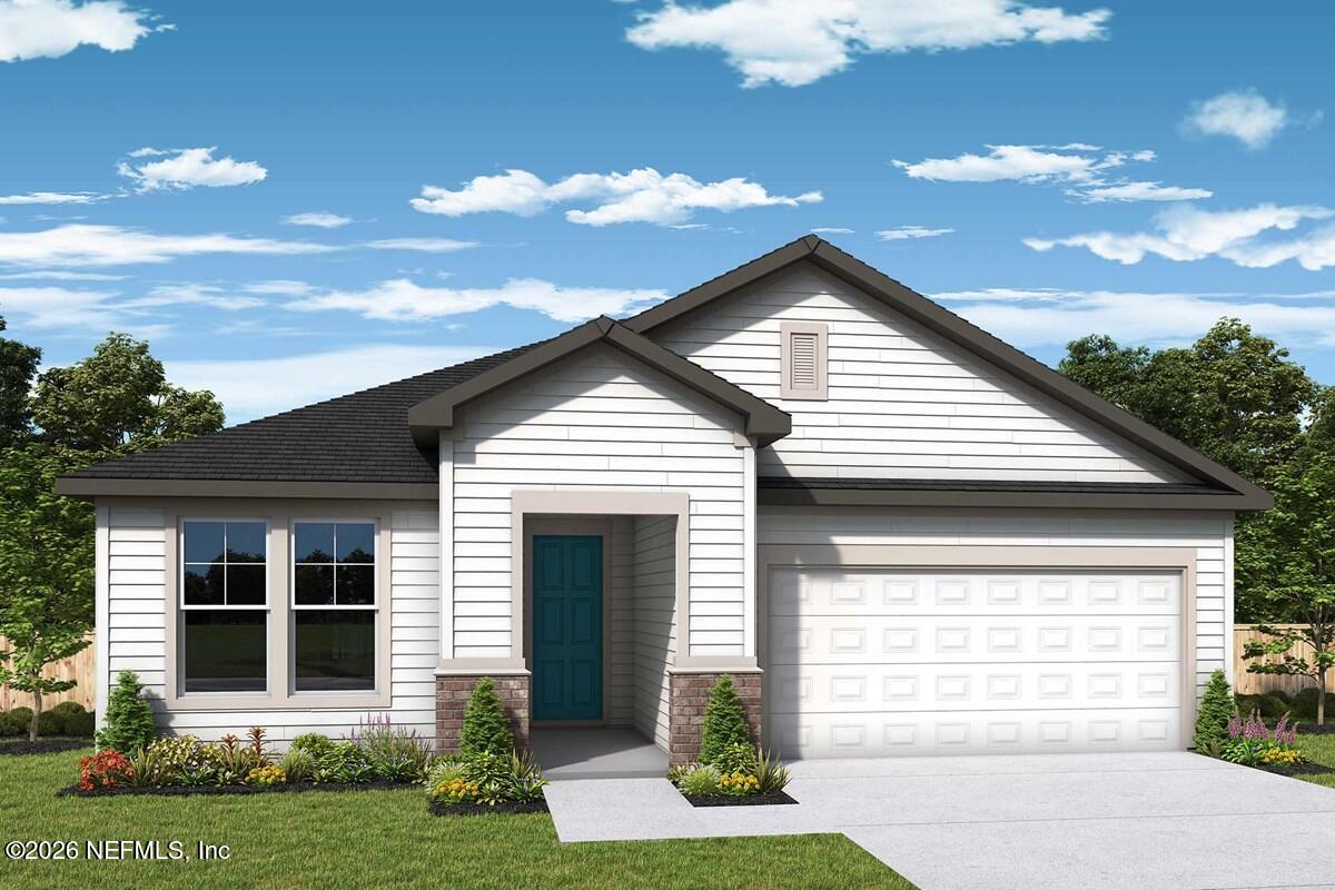 75679 Bayley Place Yulee, FL 32097 - Photo 1 of 1 a front view of a house with a yard and garage