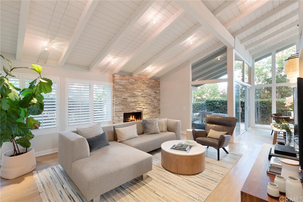 504 Avenida Largo Newport Beach, CA 92660 - Photo 14 of 36 a living room with furniture and a potted plant