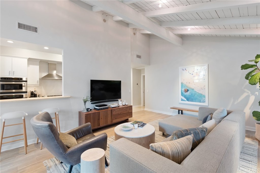 504 Avenida Largo Newport Beach, CA 92660 - Photo 15 of 36 a living room with furniture and a flat screen tv