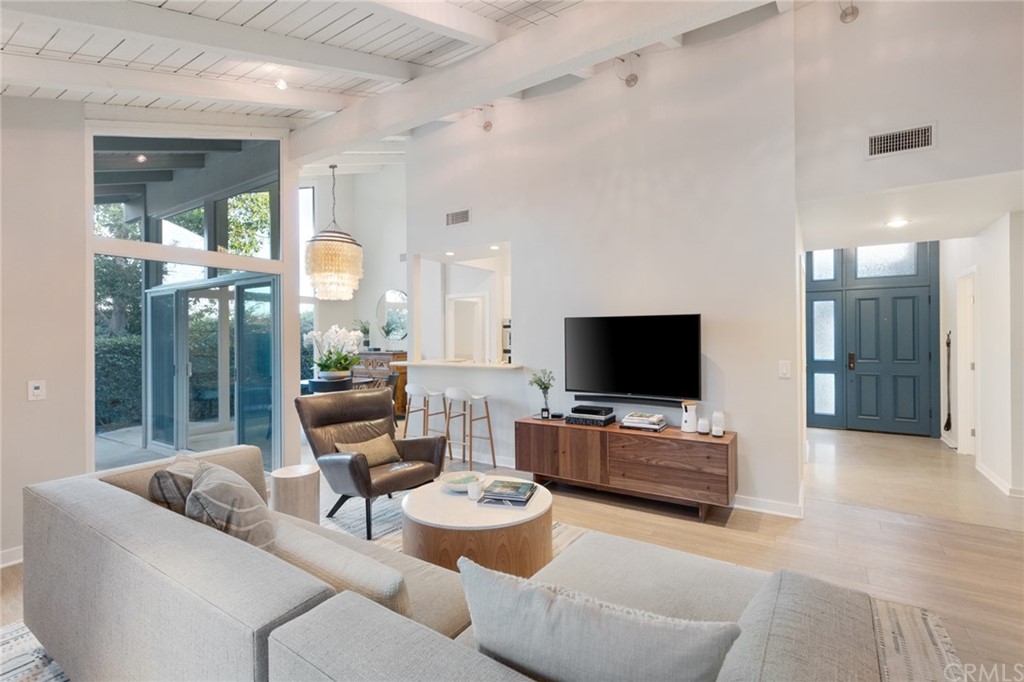 504 Avenida Largo Newport Beach, CA 92660 - Photo 16 of 36 a living room with furniture and a flat screen tv