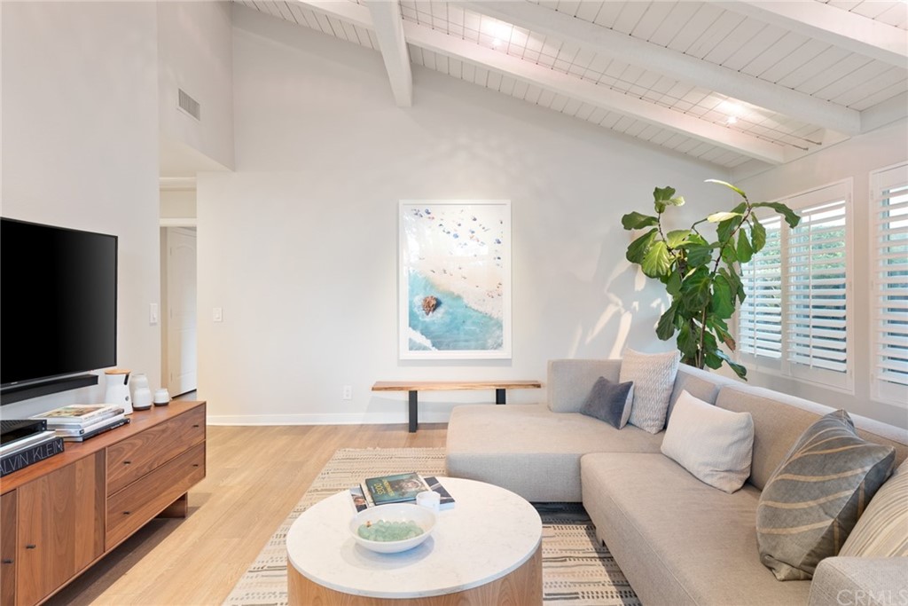 504 Avenida Largo Newport Beach, CA 92660 - Photo 17 of 36 a living room with furniture and a flat screen tv