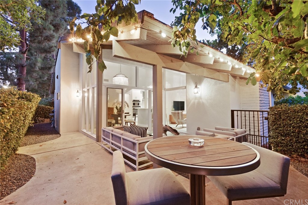 504 Avenida Largo Newport Beach, CA 92660 - Photo 26 of 36 a dining room with a table and chairs