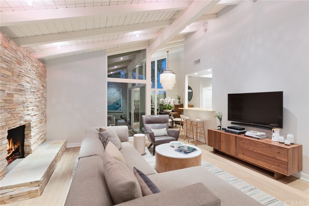 504 Avenida Largo Newport Beach, CA 92660 - Photo 29 of 36 a living room with furniture and a flat screen tv