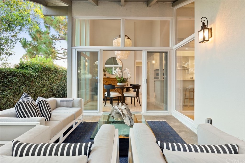 504 Avenida Largo Newport Beach, CA 92660 - Photo 3 of 36 a view of a balcony with furniture and wooden floor