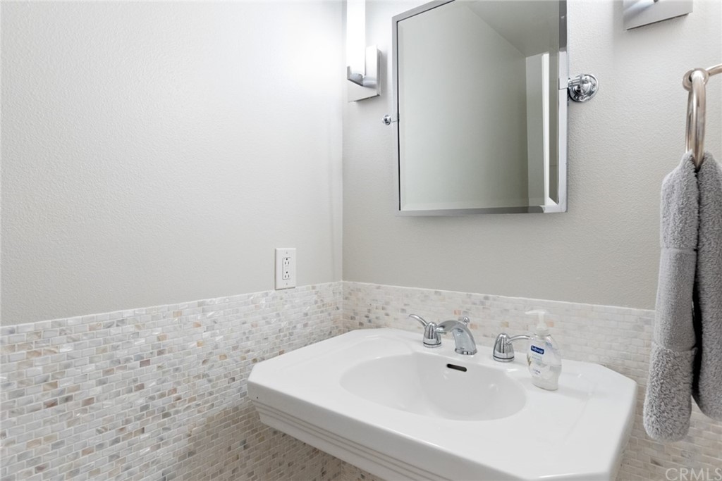 504 Avenida Largo Newport Beach, CA 92660 - Photo 31 of 36 a bathroom with a sink and mirror