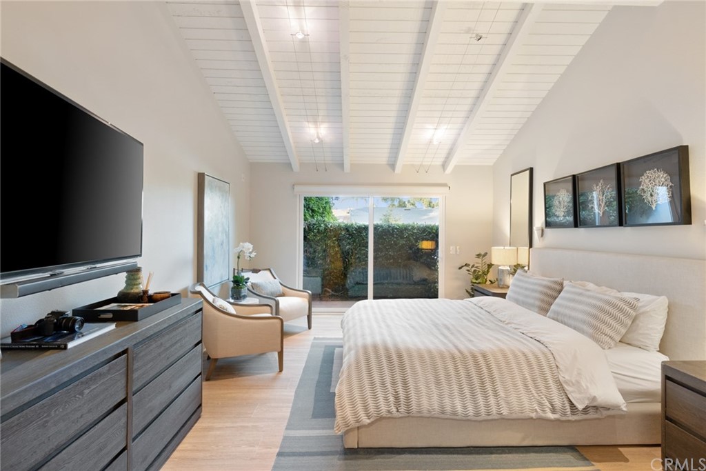 504 Avenida Largo Newport Beach, CA 92660 - Photo 6 of 36 a bedroom with a bed and glass wall