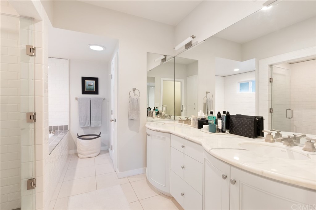 504 Avenida Largo Newport Beach, CA 92660 - Photo 9 of 36 a bathroom with a double vanity sink a toilet and a shower