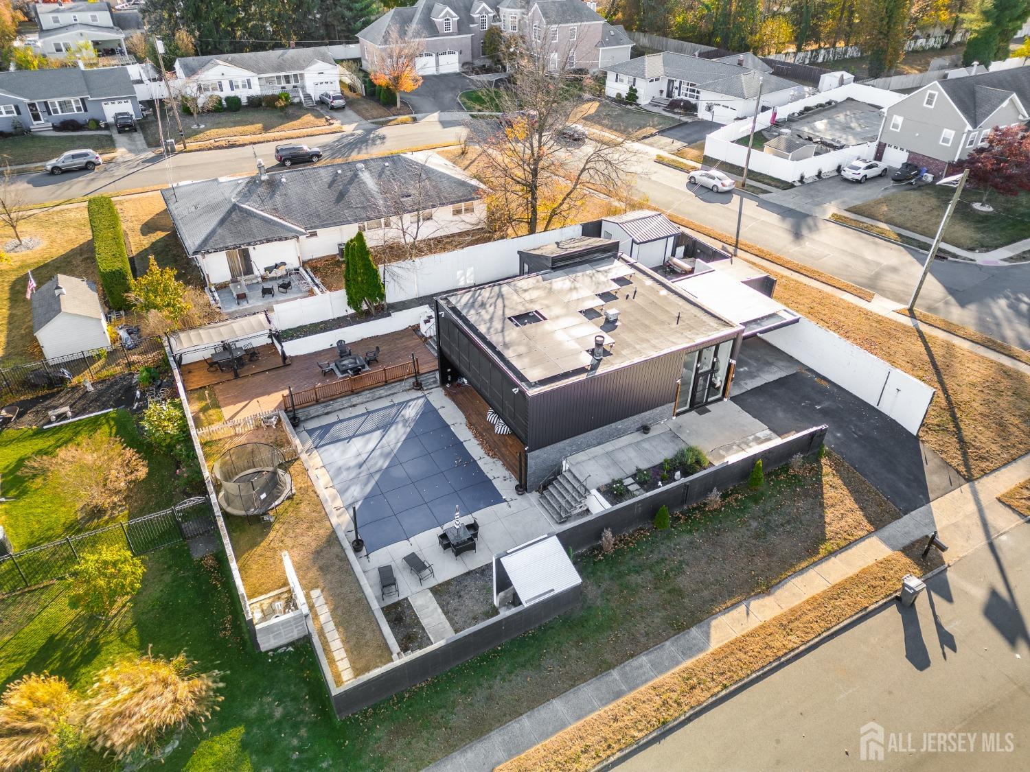123 Risoli Terrace South Plainfield, NJ 07080 - Photo 18 of 46 a view of a house with pool and chairs