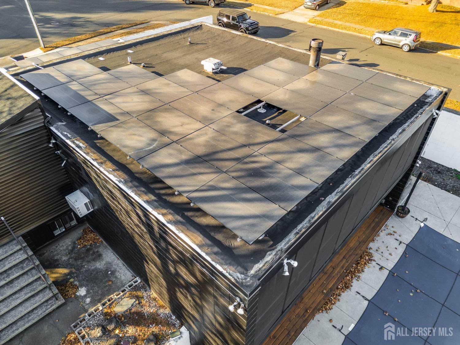 123 Risoli Terrace South Plainfield, NJ 07080 - Photo 21 of 46 a view of a backyard with sitting area