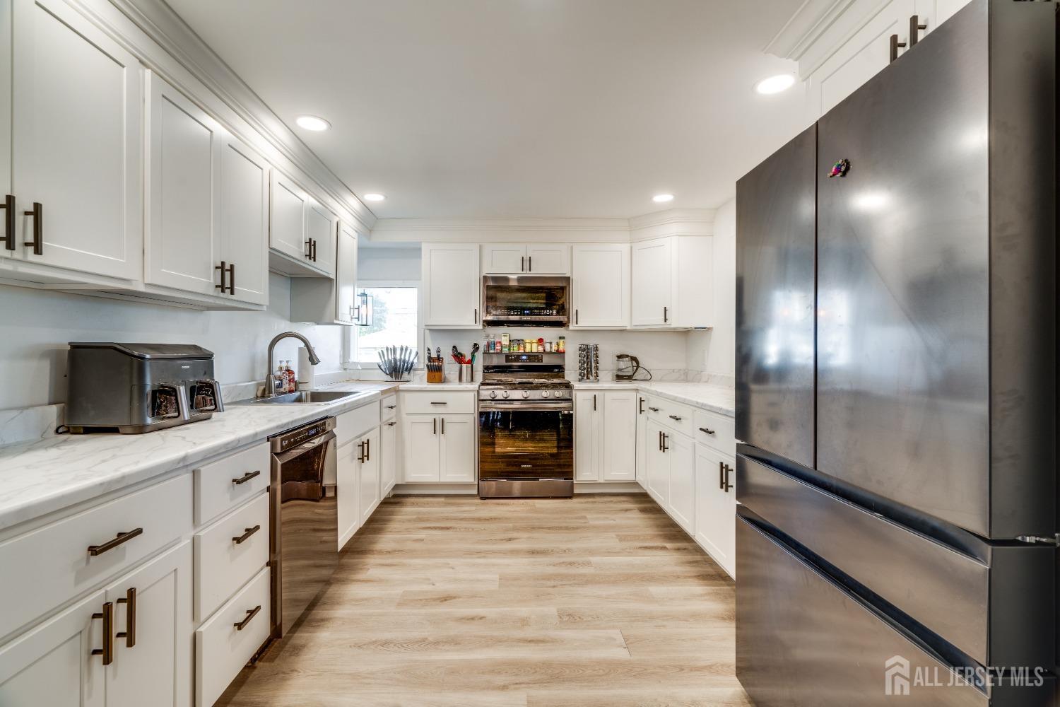 123 Risoli Terrace South Plainfield, NJ 07080 - Photo 29 of 46 a kitchen with granite countertop a refrigerator stove and sink