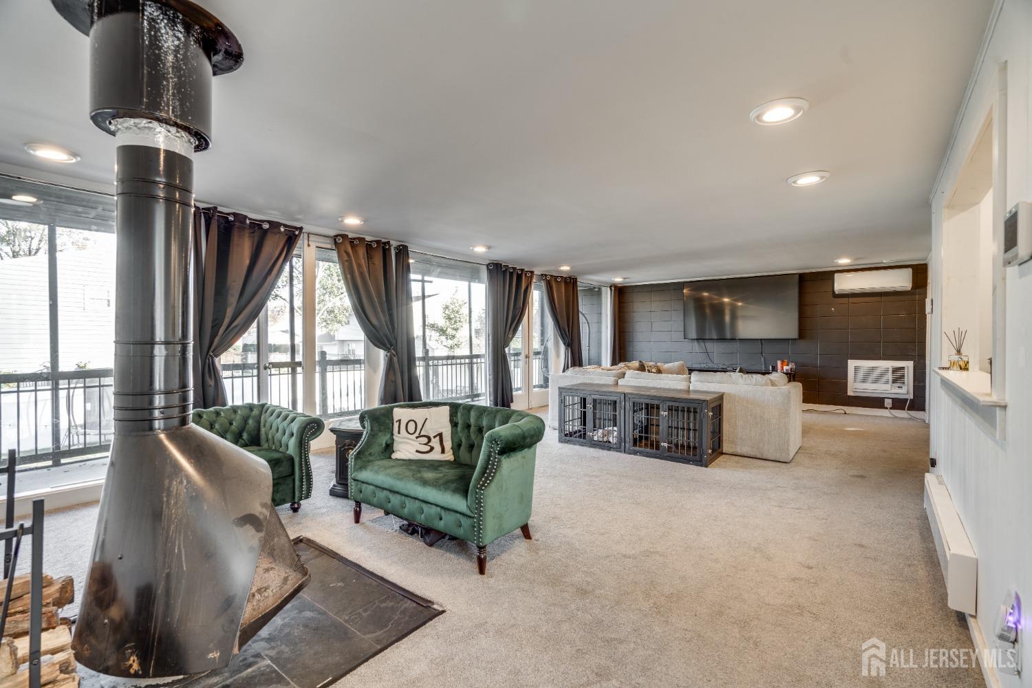 123 Risoli Terrace South Plainfield, NJ 07080 - Photo 36 of 46 a living room with furniture and a large window