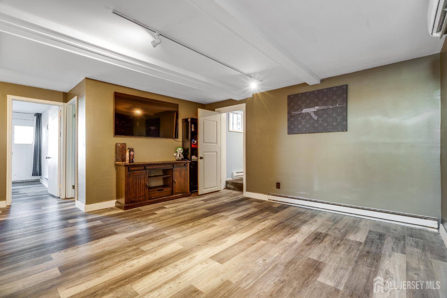 123 Risoli Terrace South Plainfield, NJ 07080 - Photo 39 of 46 a view of a livingroom with a flat screen tv