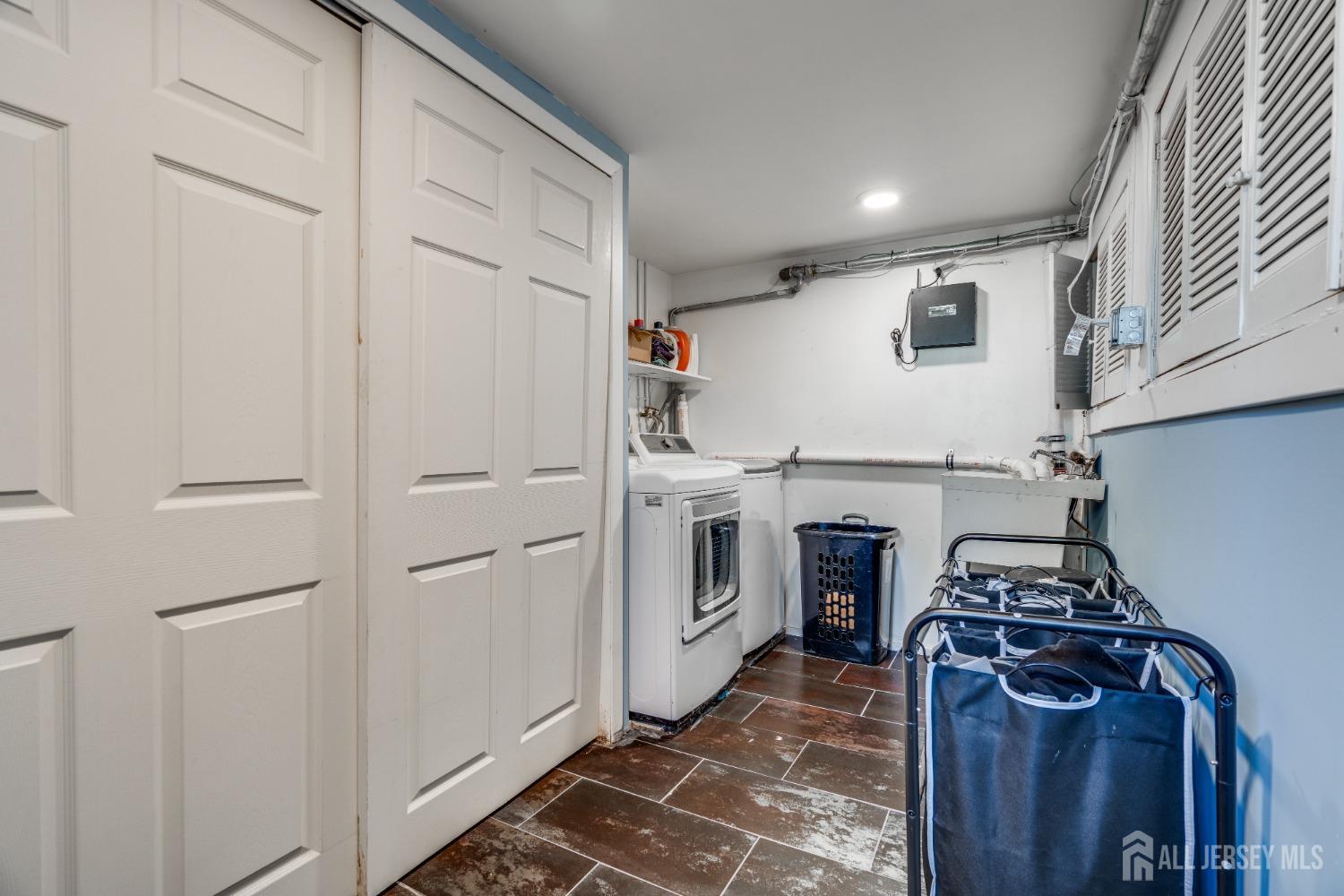 123 Risoli Terrace South Plainfield, NJ 07080 - Photo 46 of 46 a view of a storage and utility room with washer and dryer