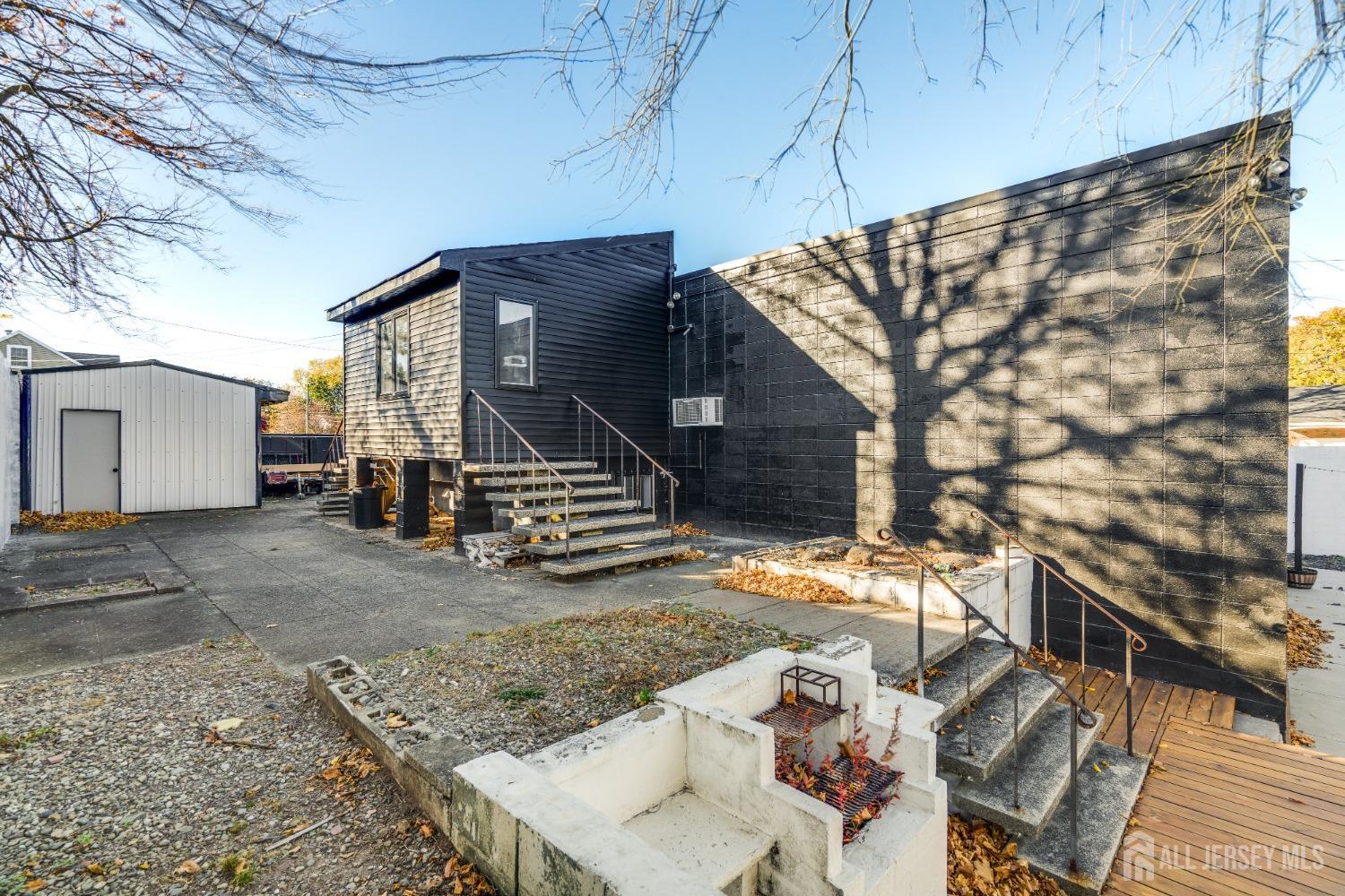 123 Risoli Terrace South Plainfield, NJ 07080 - Photo 9 of 46 a view of a house with a yard