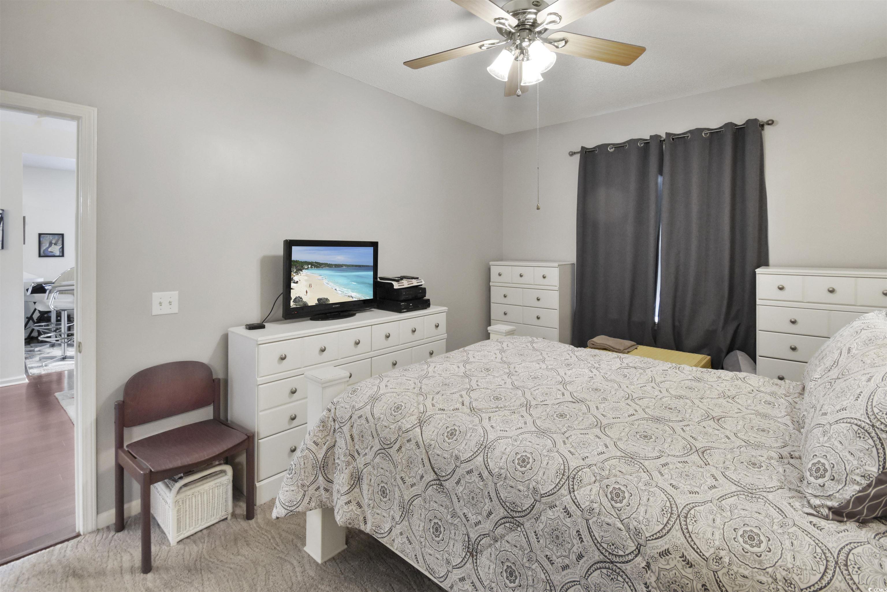 4502 Sweetwater Boulevard, Unit 4502 Murrells Inlet, SC 29576 - Photo 15 of 28 Bedroom featuring ceiling fan and light carpet