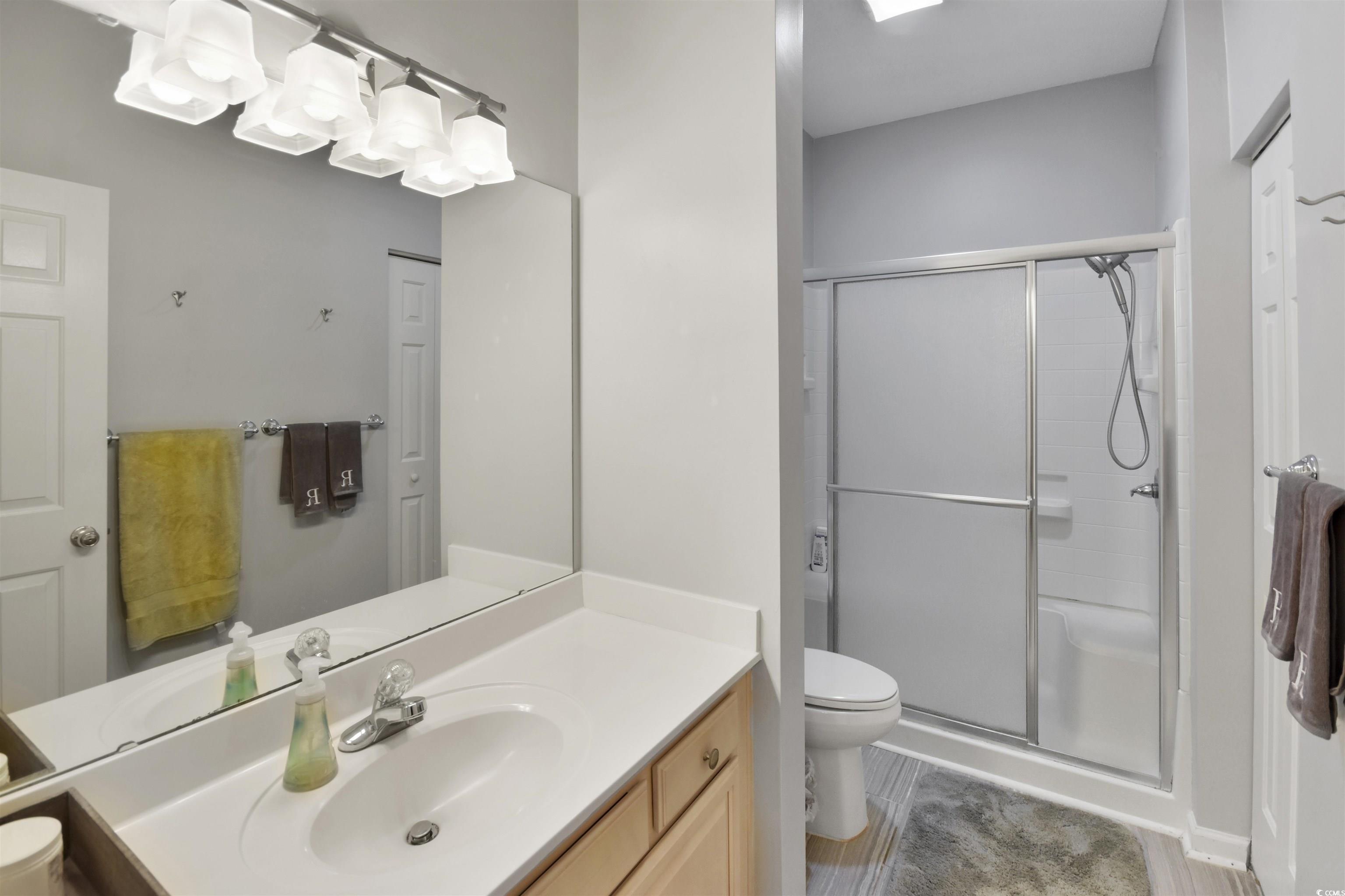 4502 Sweetwater Boulevard, Unit 4502 Murrells Inlet, SC 29576 - Photo 18 of 28 Bathroom featuring vanity and a shower stall